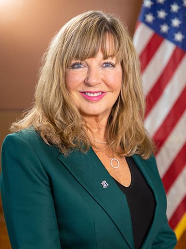 Official portrait of Carol McEntee, archived from ri-ga-member-directory.