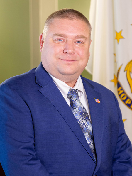 Official portrait of Brian Thompson.